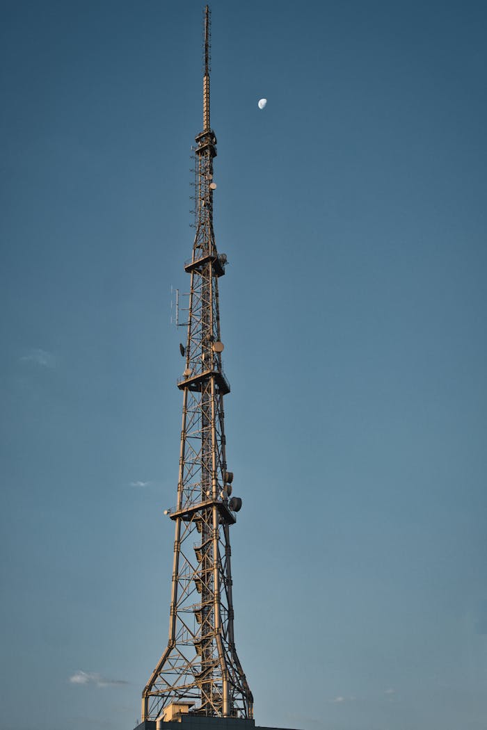 gallery-02 Tall steel telecommunication tower with moon in the sky, São Paulo.